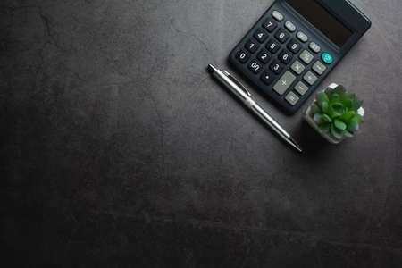 Top view of black calculator with pen and copy space. Technology and financial concept.の写真素材