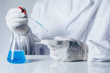 Researcher with glass laboratory chemical test tubes with liquid for analytical , medical,...