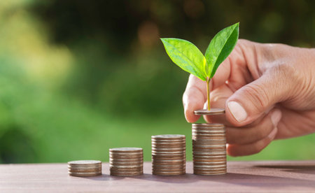 Hand with money coins stack, Business investment growth concept, saving concept, Hand putting stack...