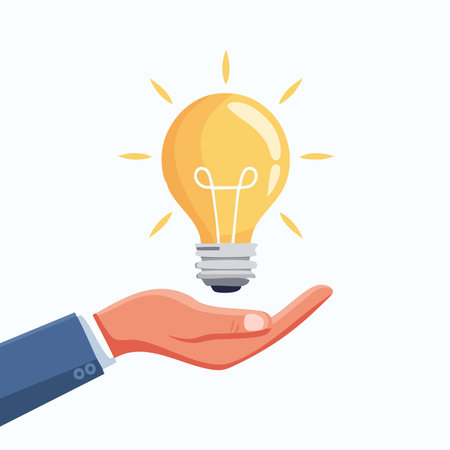 Flat hand holding a yellow glowing bulb, idea and innovation concept, clean modern design with soft shadows and white background, perfect for presentationsのイラスト素材
