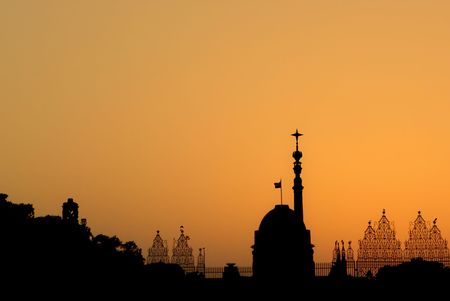 The silhouette of Rashtrapati Bhavan - the President House of India and the symbol of the success of the largest democracy of the world - on the background of orange color.の写真素材