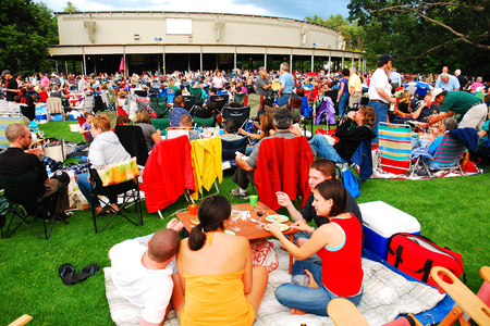 A Group of Young Friends Enjoy Dinner and Wine Prior to a Concert at Tanglewood Massachusettsのeditorial素材