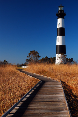 A Path Through the Marsh Leads to the Bodie Island Lighthouse, Outer Banks, North Carolinaの写真素材