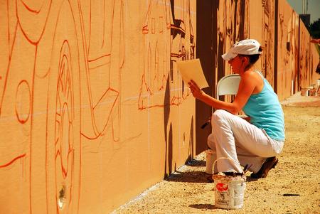 Painting a mural along the interstate, Denton Texasのeditorial素材