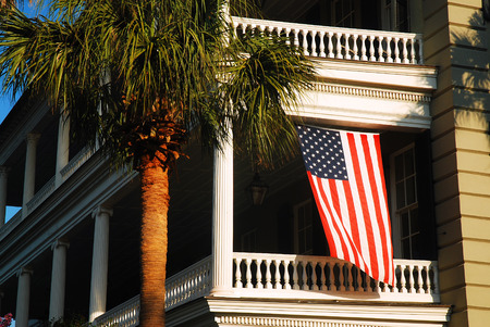American Flag Hangs from a Balcony, Charleston SCのeditorial素材