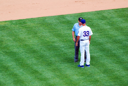A baseball manager argues a call with an umpireのeditorial素材