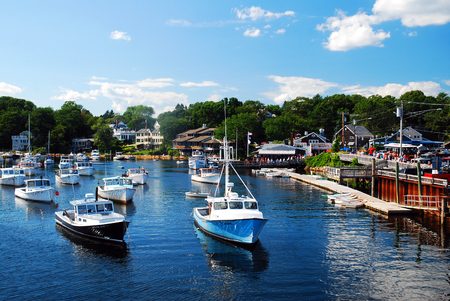 Boats populate the channel at Perkins Cove in Ogunquit, Maineのeditorial素材