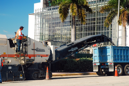 Workers repair a road in Miami Beach, Floridaのeditorial素材