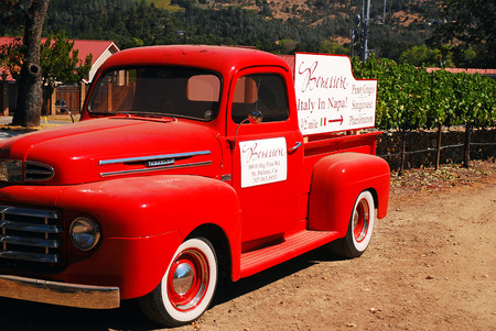 An antique red pick up truck is used to lure visitors to a winery in the Napa Valleyのeditorial素材