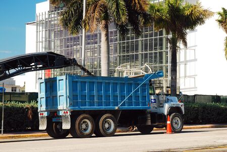 A crew repairs the road in Miami Beachのeditorial素材