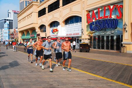 A team of cadets jog along the Boardwalk, Atlantic Cityのeditorial素材