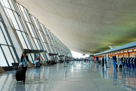 Travelers walk in the Main Terminal Building of Dulles International Airportのeditorial素材