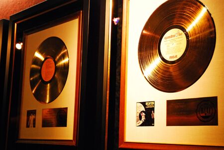 Gold records awarded to Elvis Presley hang on a wall at Gracelandのeditorial素材