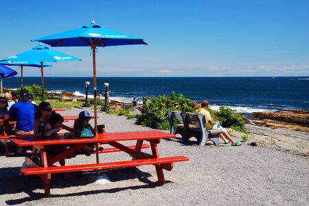 Folks enjoy a picnic spot on the Coast of Maineのeditorial素材
