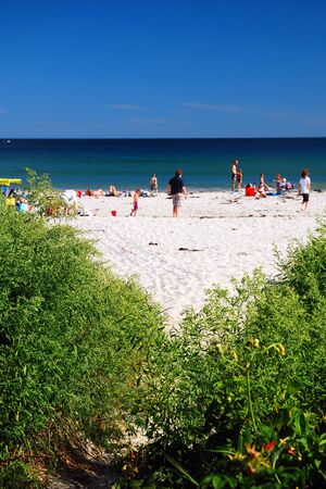 A late afternoon crowd at Goose Rocks Beach, Maineのeditorial素材