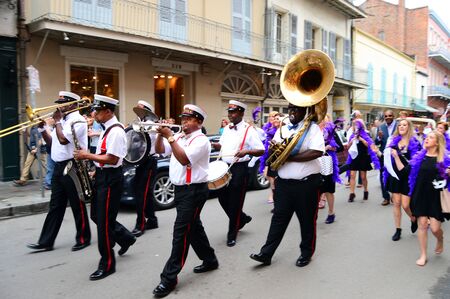 A Second Line leads a procession through the French Quarter of New Orleansのeditorial素材