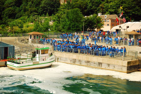 A Crowd Gathers for the Maid of the Mist boat ride in Niagara Falls, Canadaのeditorial素材