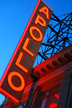 The marquee of the famous Apollo Theatre, in Harlem, New York City, glows in twilightのeditorial素材