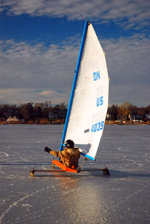 An adult man takes his small ice yacht out on a frozen Navasink River in Red Bank, New Jerseyのeditorial素材