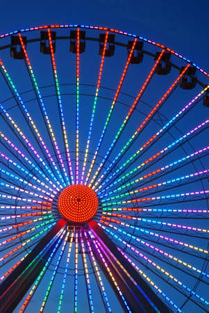 A Ferris Wheel lights up the night on the Boardwalk in Wildwood, New Jerseyの写真素材