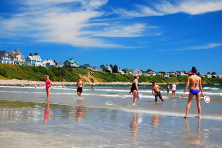 Folks enjoy playing on Long Sands Beach in York, Maine