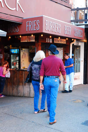 A couple approaches the Love Shack, a popular eatery at the Ft Worth Stock Yards, Texasのeditorial素材