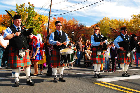 A bagpipe and drum band gets set to lead a Halloween parade through downtown Cranford, New Jerseyのeditorial素材
