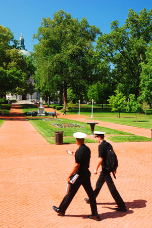 Two Midshipmen stroll through Radcliffe Terrace at the US Naval Academy in Annapolis, Marylandのeditorial素材