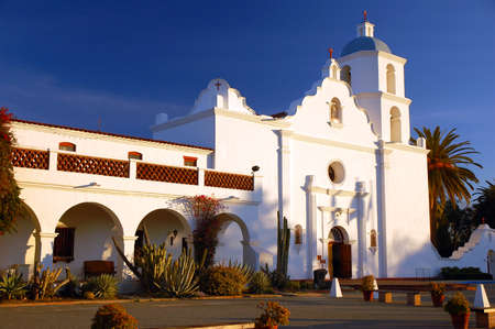The Mission San Luis Rey de Francia glows brightly in the California sunlightのeditorial素材