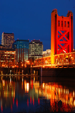 The Tower Bridge and the Sacramento, California skyline are refelcted in the Sacramento Riverのeditorial素材