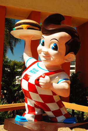 A larger than life Mascot stands outside of the Bob's Big Boy restaurant in Burbank, Californiaのeditorial素材