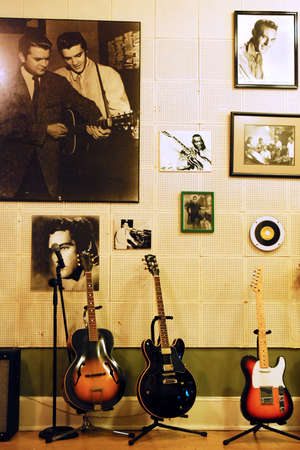 Guitars stand by the wall, full of famous musicians in Sun Studios in Memphis, Tennesseeのeditorial素材