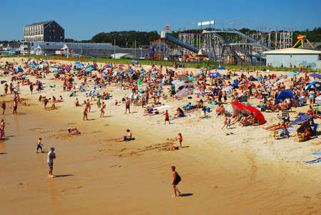 A crowd covets the sunâs rays at Old Orchard beach, Maineのeditorial素材