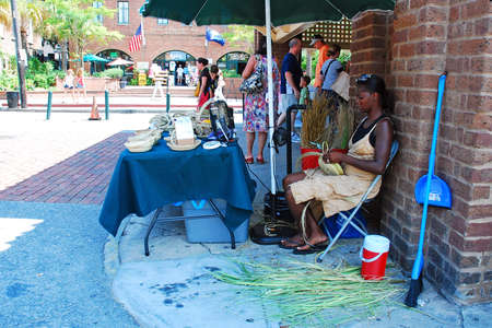 A craftswoman creates stunning sweetgrass baskets in Charleston, South Carolina, using traditional methods and techniques handed down through generationsのeditorial素材