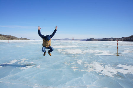 Jump on the ice of Lake Baikalの写真素材