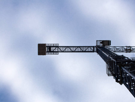 Crane against the blue sky with the type of landの写真素材