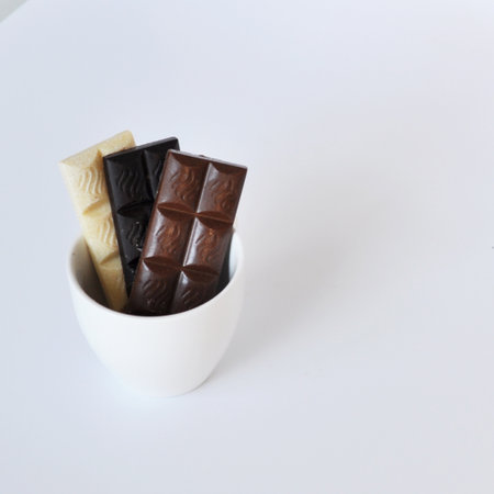 Handmade Chocolate Bars Composition on Light Background
