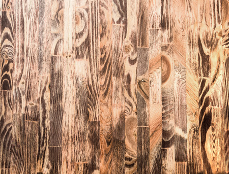 Photos on a wooden surface of small boardsの写真素材