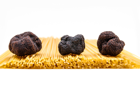 Three mushroom truffle, which lie on the pasta spaghetti , white backgroundの写真素材