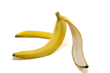 Isolated yellow banana peel on the white backgroundの写真素材
