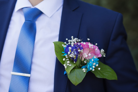 boutonniere in the blue jacket of the groomの写真素材