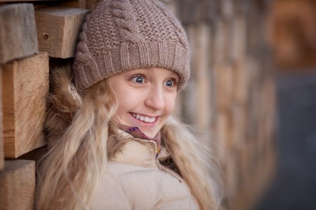 Happy child girl is in sunset winter.の写真素材