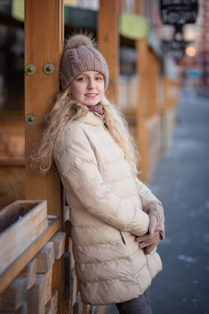 Happy child girl is in sunset winter.の写真素材
