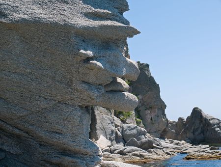 Rock of the unusual form as a fantastic monster. Sunny day.  Russian Far Easr, Primorye, Petrova island, nature state reserve Lazovsky.の写真素材