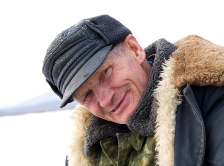 A portrait of the old man on winter fishing.