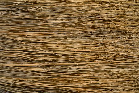 The texture of the surface of pack of dry yellow grass.の写真素材