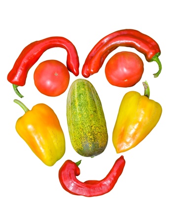 A close up of the face made from vegetables. Isolated on white.の写真素材