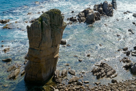 The rock in sea, stones, reefs and surf.の写真素材