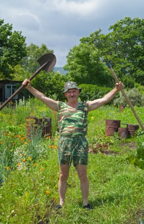 A man with garden's tool.の写真素材