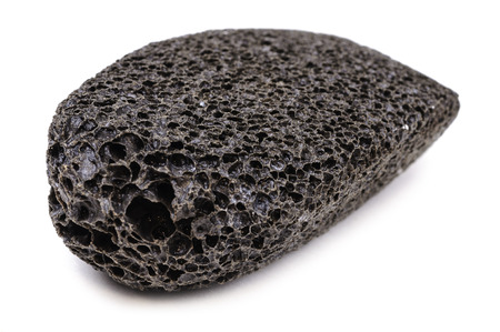 Piece of pumice-stone for skin care  Close-up with Shallow Depth of Field  Isolated on white background  の写真素材